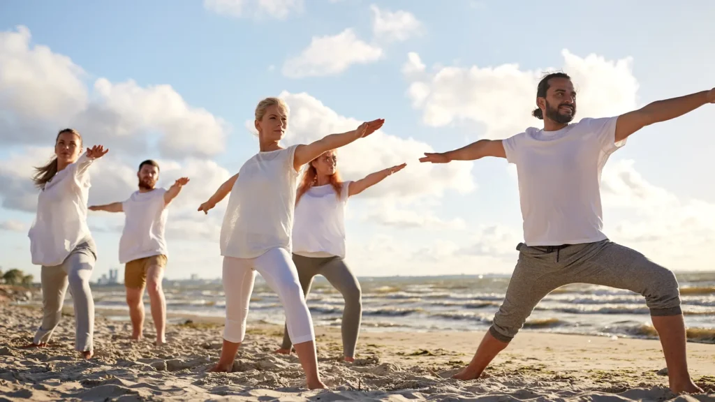 Adult Holistic Therapy Yoga - Channel Islands Mental Health Treatment Center Group outdoor beach yoga therapy